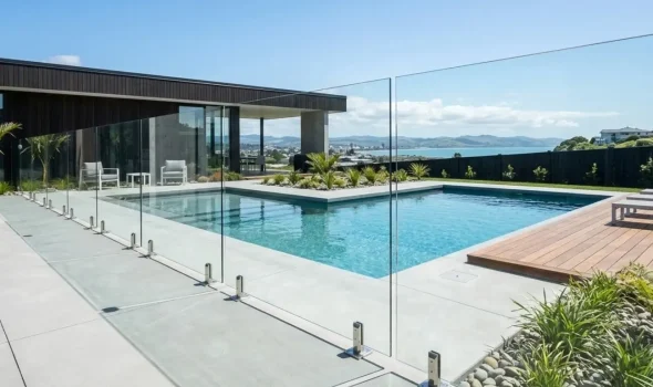 Vertical black aluminum slat pool fencing demonstrates customisable styles to suit your property by Fence Builders Palmerston North.